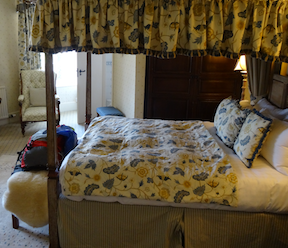 Hotel room with large canopy bed